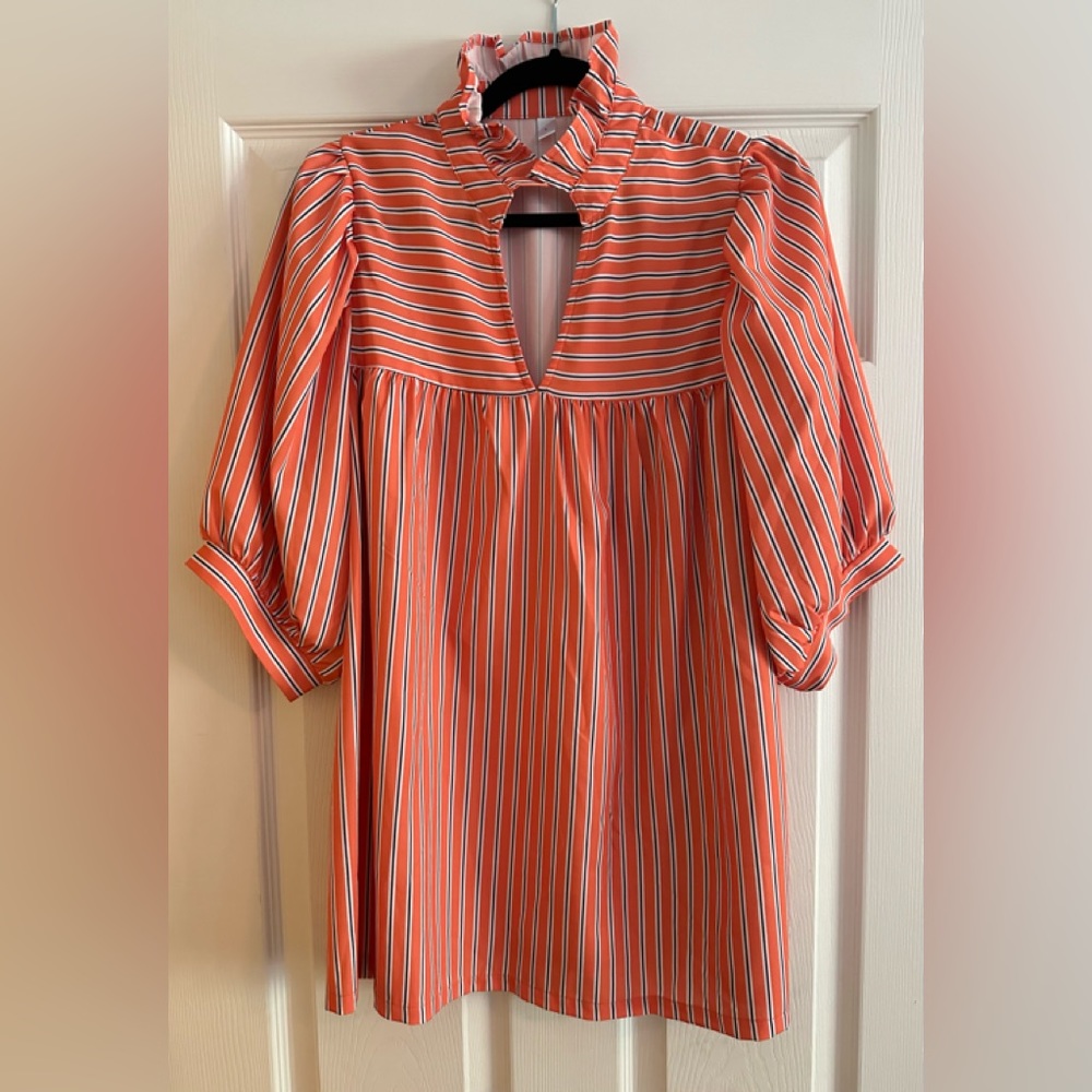 New without tags size large. Orange pinstripe blouse.